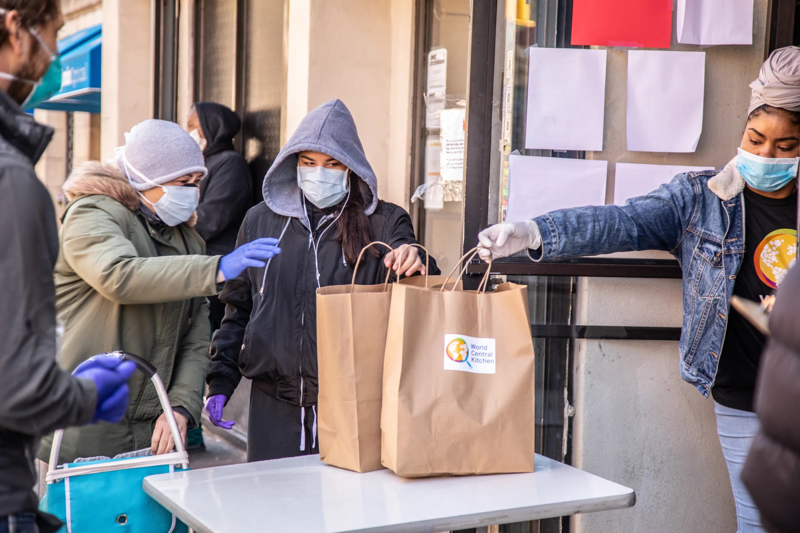 Two volunteers distribute emergency goods in New York City.